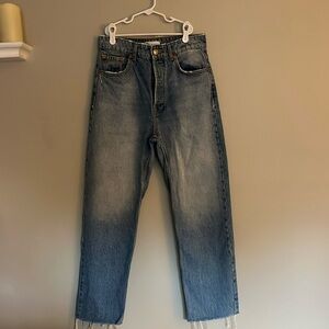 light/medium wash straight leg jeans with 4 button closure and frayed ends